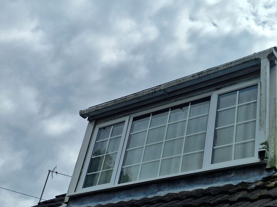 White fascia, soffit and dormer window after cleaning