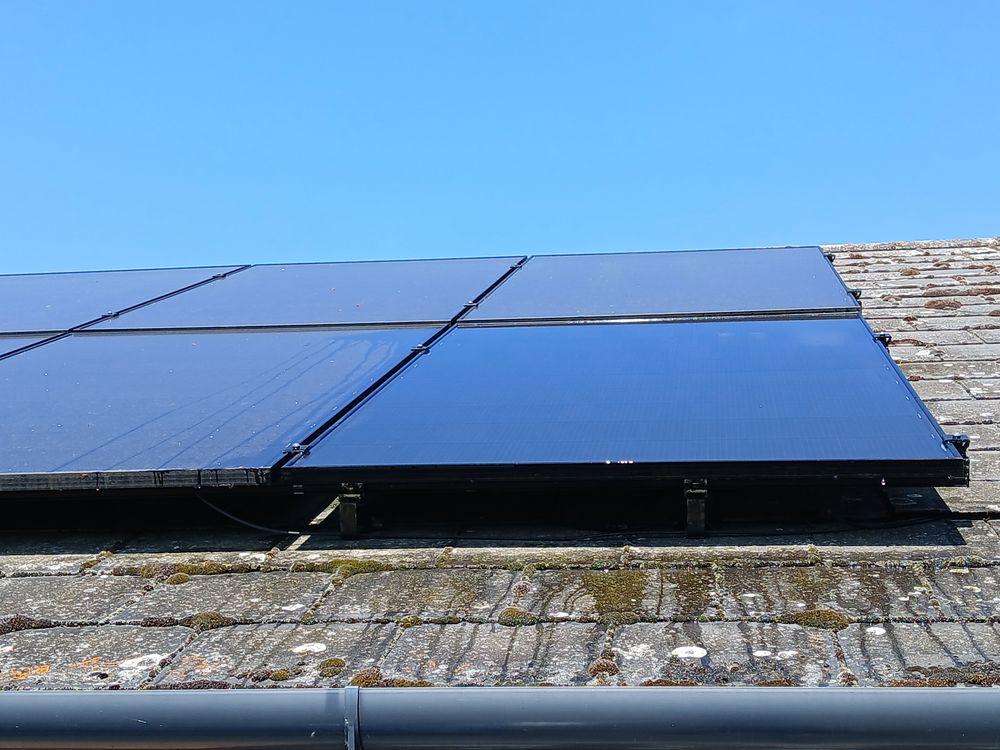 Solar panel array on a bungalow roof after cleaning